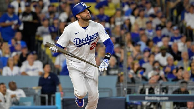 Oct 9, 2023; Los Angeles, California, USA; Los Angeles Dodgers designated hitter J.D. Martinez (28) hits a home run against the Arizona Diamondbacks during the fourth inning for game two of the NLDS for the 2023 MLB playoffs at Dodger Stadium. Mandatory Credit: Jayne Kamin-Oncea-USA TODAY Sports  